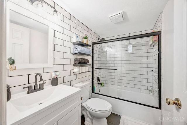 8798 Beckys Ridge Dr, Colerain Twp, OH 45251 - full bath with tile walls, vanity, enclosed tub / shower combo, and decorative backsplash
