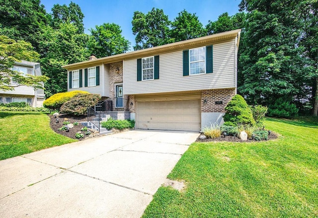 8798 Beckys Ridge Dr, Colerain Twp, OH 45251 - split foyer home featuring concrete driveway, a front lawn, a garage, brick siding, and a chimney