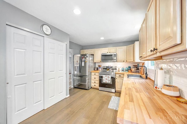 8798 Beckys Ridge Dr, Colerain Twp, OH 45251 - kitchen with stainless steel appliances, butcher block counters, light wood-type flooring, recessed lighting, and light brown cabinets