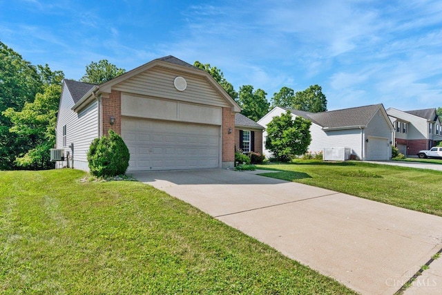 1583 Creekside Rd, Batavia Twp, OH 45102 - view of front of house featuring a garage, brick siding, a front yard, and concrete driveway