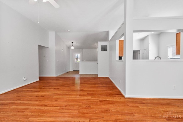 1583 Creekside Rd, Batavia Twp, OH 45102 - unfurnished living room with healthy amount of natural light, light wood-type flooring, a ceiling fan, and lofted ceiling