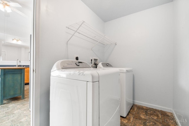 1583 Creekside Rd, Batavia Twp, OH 45102 - laundry area featuring washer and dryer, ceiling fan, and stone finish floors