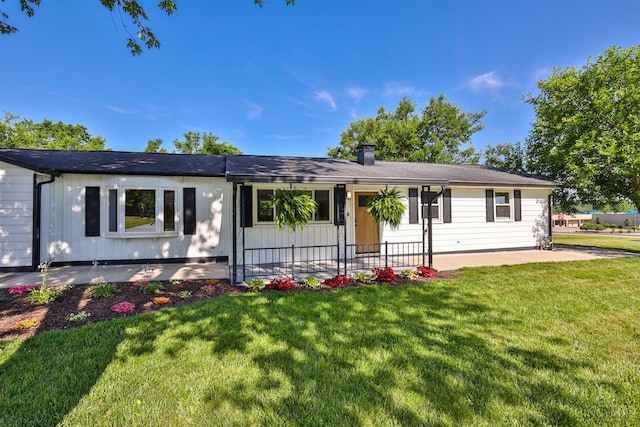 711 S Main St, Monroe, OH 45050 - ranch-style house with a front yard and a patio area