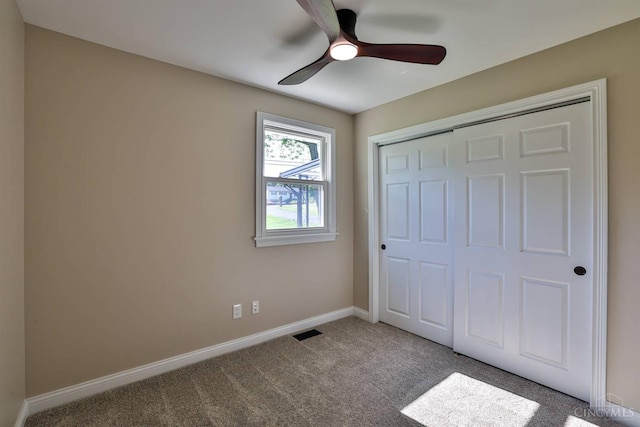 711 S Main St, Monroe, OH 45050 - unfurnished bedroom with carpet flooring, a closet, and a ceiling fan