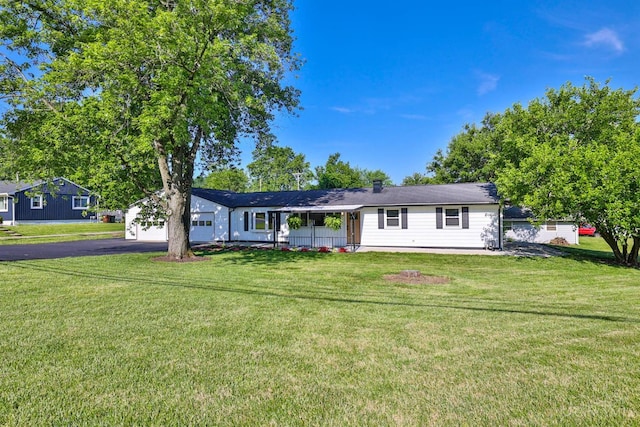 711 S Main St, Monroe, OH 45050 - ranch-style house with a garage, driveway, and a front lawn