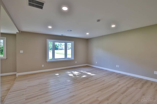 711 S Main St, Monroe, OH 45050 - empty room featuring light wood-type flooring, recessed lighting, and a smoke detector