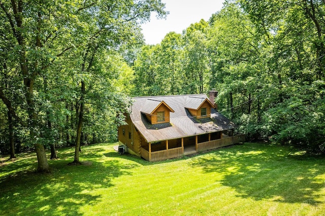 2914 Pond Run Ln, Pierce Twp, OH 45157 - back of property with covered porch, a lawn, a chimney, and a view of trees