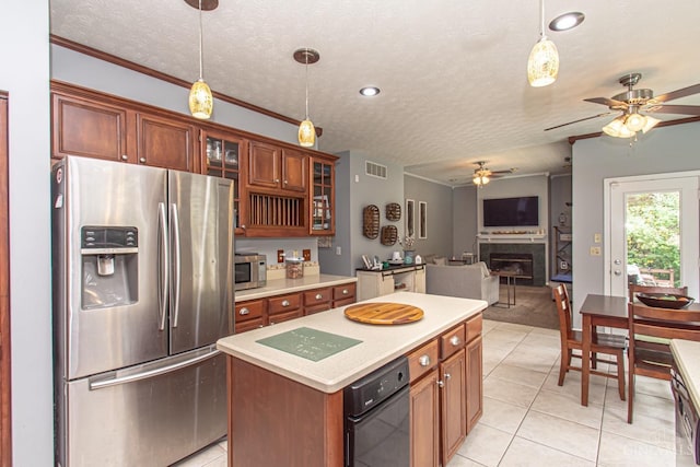 1887 Bantas Creek Rd, Washington Twp, OH 45320 - kitchen featuring stainless steel appliances, light tile patterned floors, a textured ceiling, ceiling fan, and decorative light fixtures