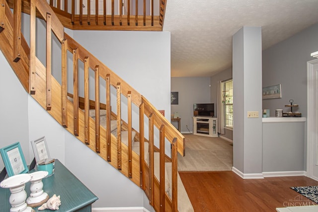 1887 Bantas Creek Rd, Washington Twp, OH 45320 - stairs with wood finished floors and a textured ceiling