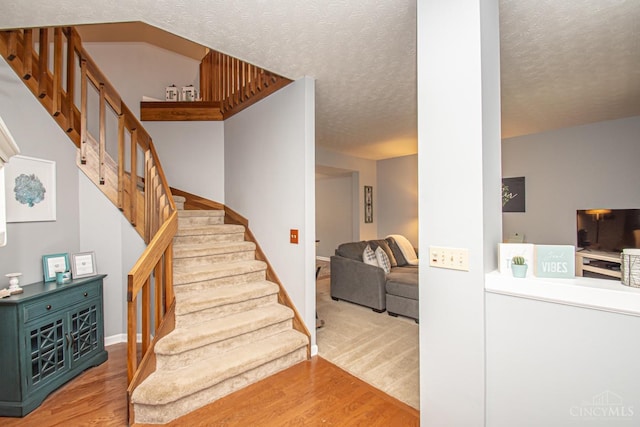 1887 Bantas Creek Rd, Washington Twp, OH 45320 - stairs with wood finished floors and a textured ceiling