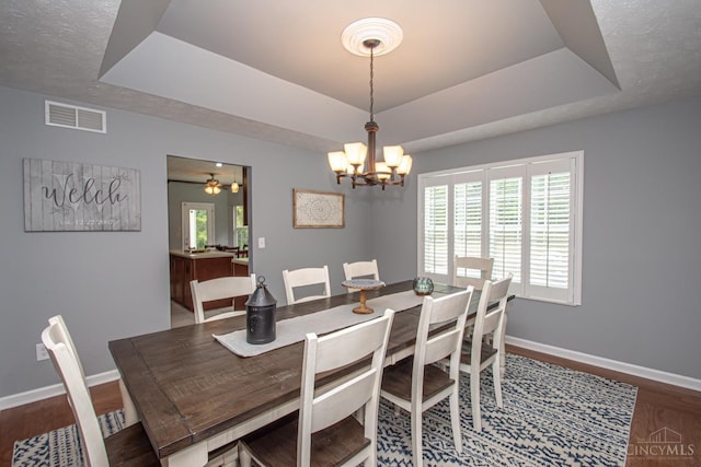 1887 Bantas Creek Rd, Washington Twp, OH 45320 - dining space with a raised ceiling, wood finished floors, and healthy amount of natural light