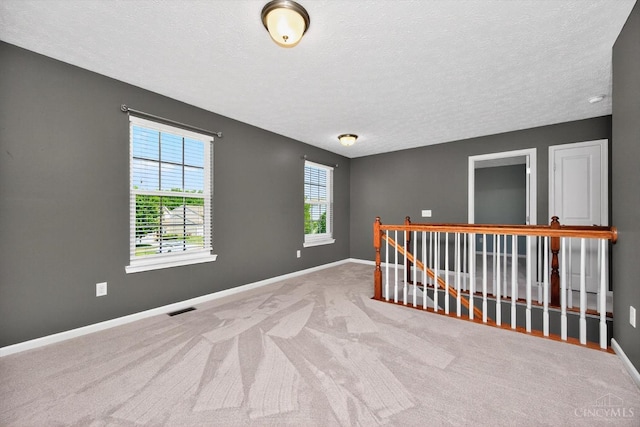 9985 Scotch Pine Dr, Clearcreek Twp, OH 45066 - carpeted empty room featuring baseboards and a textured ceiling