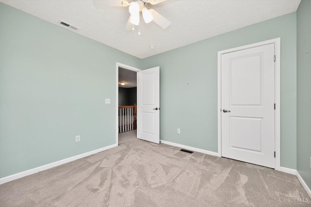 9985 Scotch Pine Dr, Clearcreek Twp, OH 45066 - unfurnished bedroom featuring carpet floors, a textured ceiling, and a ceiling fan