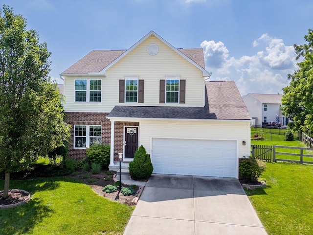 9985 Scotch Pine Dr, Clearcreek Twp, OH 45066 - traditional-style house with concrete driveway, roof with shingles, and brick siding