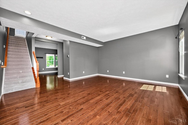 9985 Scotch Pine Dr, Clearcreek Twp, OH 45066 - unfurnished living room with wood finished floors and stairs