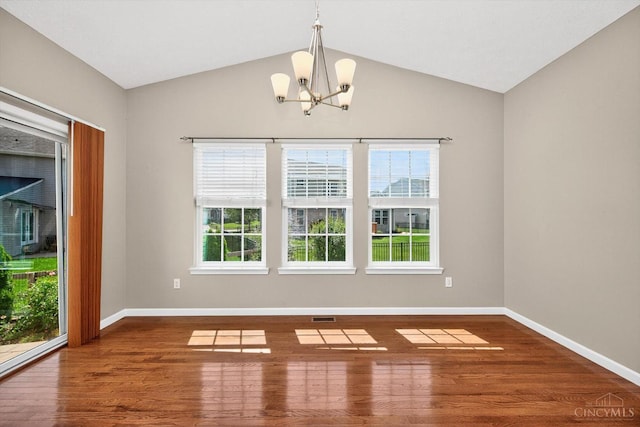 9985 Scotch Pine Dr, Clearcreek Twp, OH 45066 - empty room with a chandelier, wood finished floors, plenty of natural light, and vaulted ceiling
