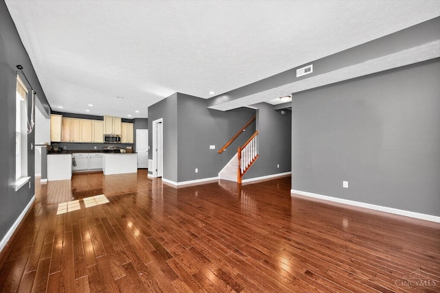 9985 Scotch Pine Dr, Clearcreek Twp, OH 45066 - unfurnished living room with stairs, dark wood finished floors, and recessed lighting