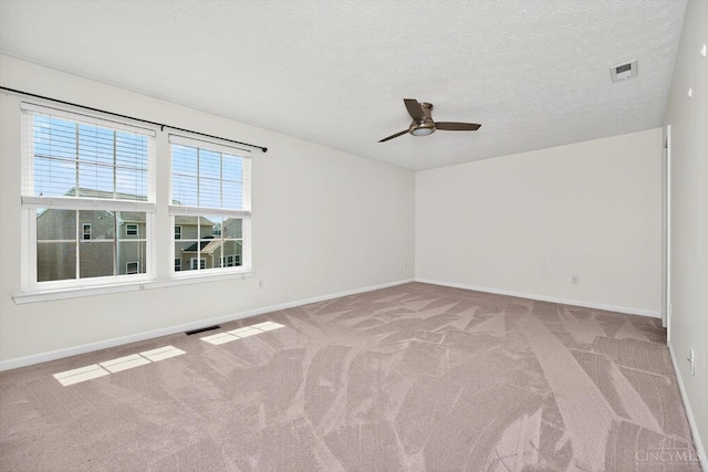 9985 Scotch Pine Dr, Clearcreek Twp, OH 45066 - unfurnished room with carpet, a ceiling fan, and a textured ceiling
