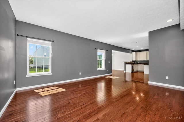 9985 Scotch Pine Dr, Clearcreek Twp, OH 45066 - unfurnished living room with wood finished floors and recessed lighting