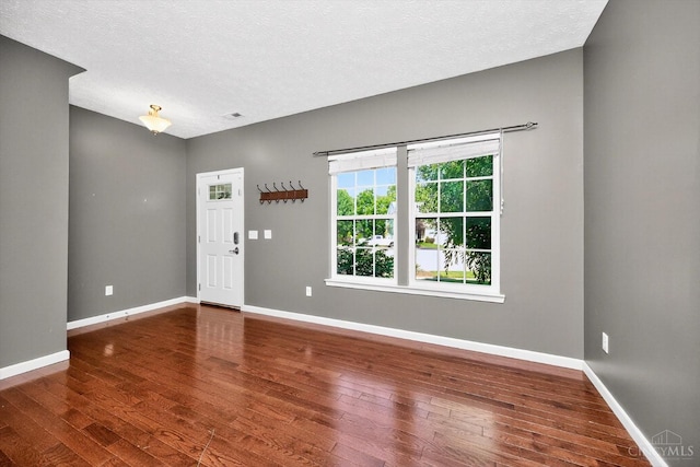 9985 Scotch Pine Dr, Clearcreek Twp, OH 45066 - foyer with hardwood / wood-style floors and a textured ceiling
