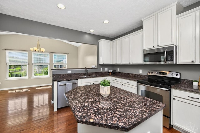 9985 Scotch Pine Dr, Clearcreek Twp, OH 45066 - kitchen featuring stainless steel appliances, white cabinets, a chandelier, dark wood-style flooring, and recessed lighting