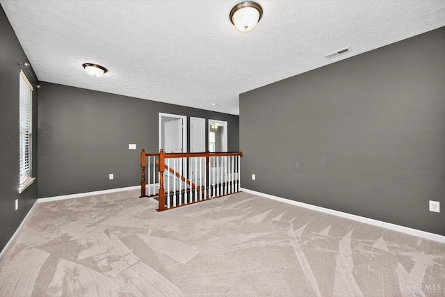 9985 Scotch Pine Dr, Clearcreek Twp, OH 45066 - empty room featuring carpet and a textured ceiling