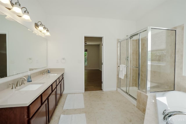 688 Humock Ct, Hamilton Twp, OH 45039 - bathroom with double vanity, a bath, a stall shower, and tile patterned floors