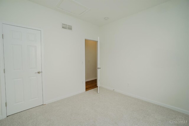 688 Humock Ct, Hamilton Twp, OH 45039 - carpeted spare room featuring baseboards and attic access