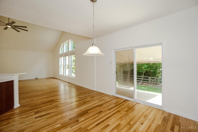 688 Humock Ct, Hamilton Twp, OH 45039 - unfurnished dining area with light wood-style floors, lofted ceiling, and ceiling fan