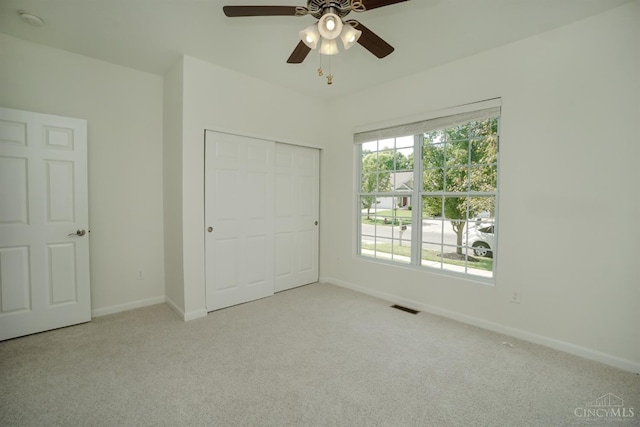 688 Humock Ct, Hamilton Twp, OH 45039 - unfurnished bedroom featuring carpet flooring, a closet, and ceiling fan