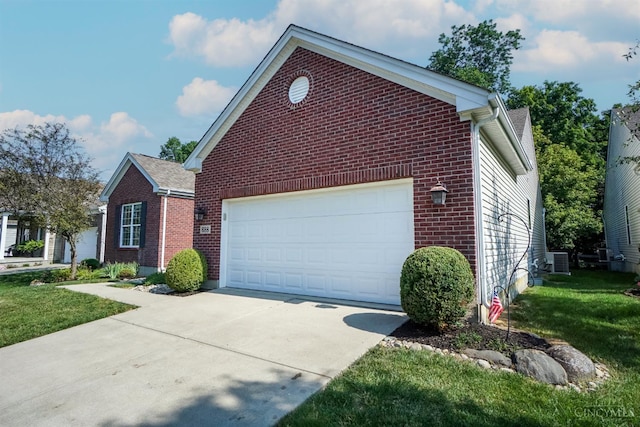 688 Humock Ct, Hamilton Twp, OH 45039 - view of front of property featuring brick siding, concrete driveway, and a front lawn