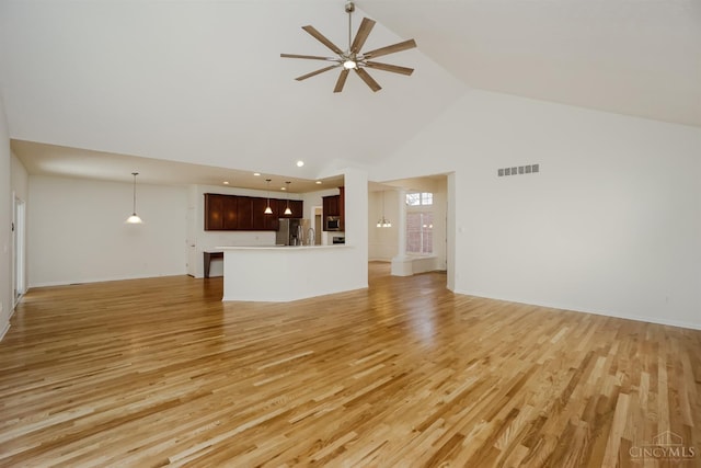 688 Humock Ct, Hamilton Twp, OH 45039 - unfurnished living room featuring high vaulted ceiling, a ceiling fan, light wood-type flooring, and recessed lighting
