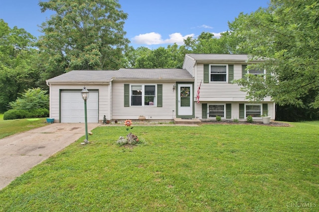 1167 Muirwood Ln, Union Twp, OH 45103 - tri-level home with a garage, concrete driveway, and a front lawn