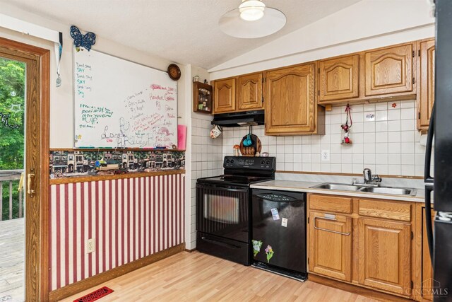 1167 Muirwood Ln, Union Twp, OH 45103 - kitchen featuring black appliances, vaulted ceiling, under cabinet range hood, light wood finished floors, and backsplash