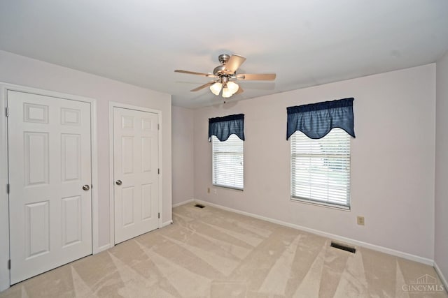 1001 Castlebay Dr, Pierce Twp, OH 45245 - unfurnished bedroom with light colored carpet and ceiling fan