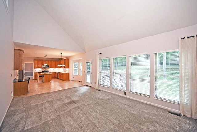 1001 Castlebay Dr, Pierce Twp, OH 45245 - unfurnished living room with light carpet and high vaulted ceiling