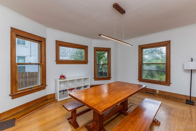 521 S Main St, Franklin, OH 45005 - dining space with light wood-type flooring and ornamental molding