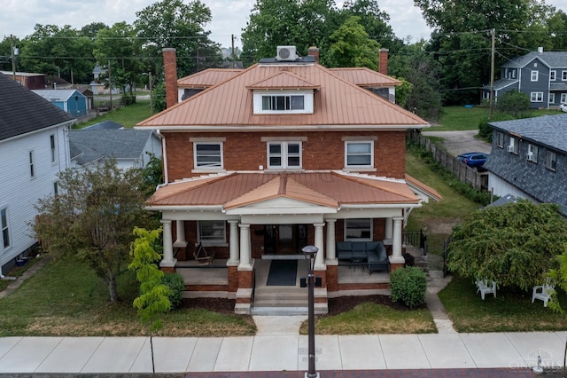 521 S Main St, Franklin, OH 45005 - view of front of house with a chimney, brick siding, and covered porch