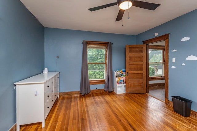 521 S Main St, Franklin, OH 45005 - empty room featuring light wood finished floors and ceiling fan