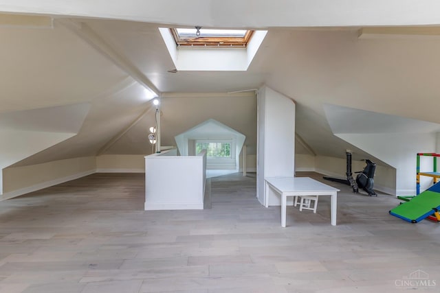 521 S Main St, Franklin, OH 45005 - additional living space with a skylight, vaulted ceiling, and wood finished floors