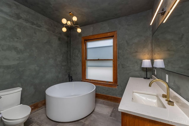 521 S Main St, Franklin, OH 45005 - full bathroom featuring a freestanding bath, vanity, and a chandelier