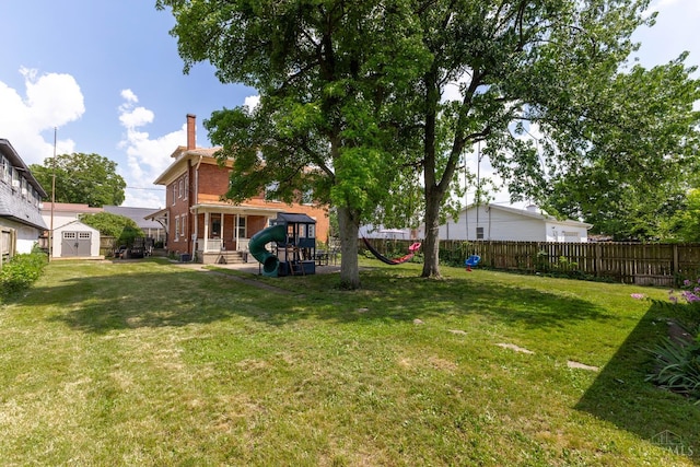 521 S Main St, Franklin, OH 45005 - view of yard with a playground and a shed