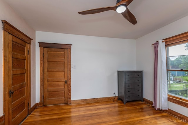 521 S Main St, Franklin, OH 45005 - unfurnished bedroom with wood finished floors and a ceiling fan