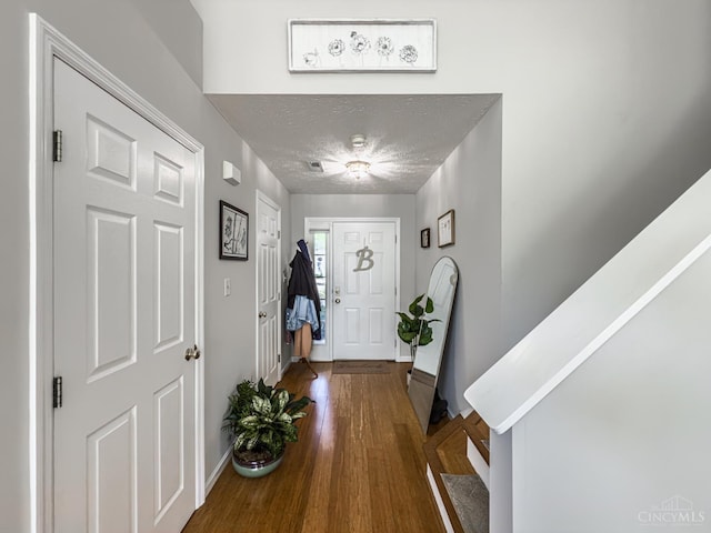 3649 Pebble Creek Ct, Mason, OH 45040 - entryway featuring stairs, wood finished floors, and a textured ceiling