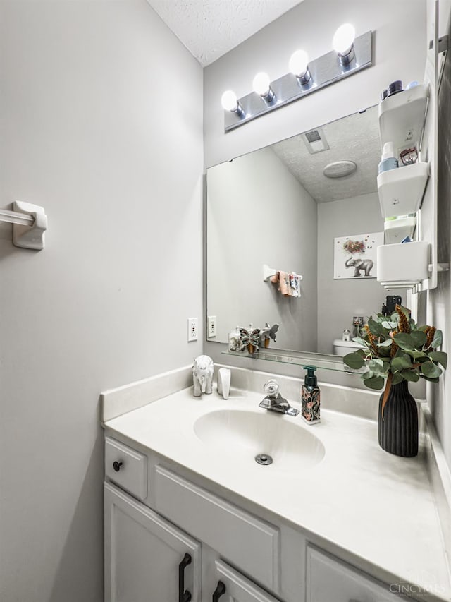 3649 Pebble Creek Ct, Mason, OH 45040 - bathroom featuring a textured ceiling and vanity