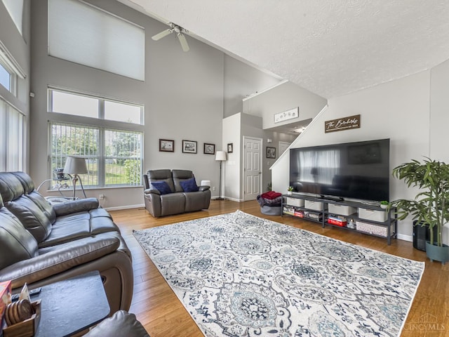 3649 Pebble Creek Ct, Mason, OH 45040 - living area with a textured ceiling, healthy amount of natural light, ceiling fan, a high ceiling, and wood finished floors