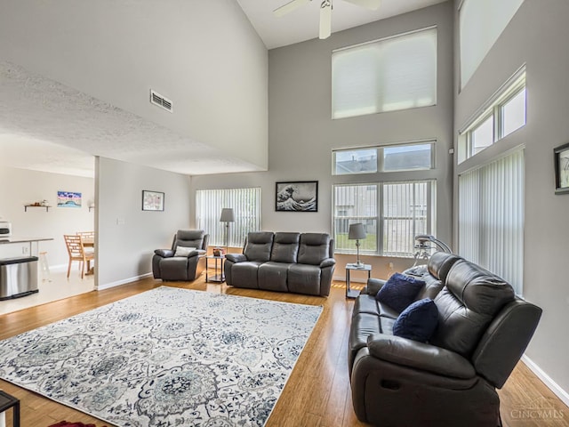 3649 Pebble Creek Ct, Mason, OH 45040 - living room with a towering ceiling, wood finished floors, and ceiling fan