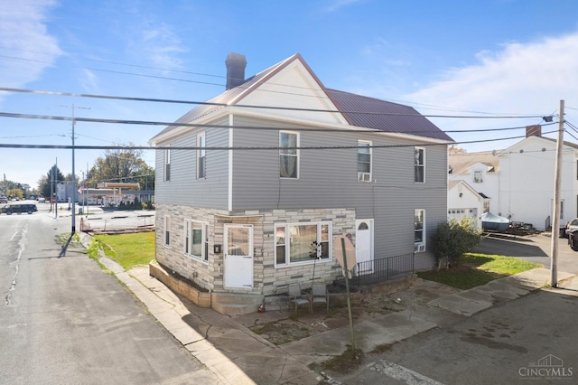 201 W Cherry St, Georgetown, OH 45121 - back of property with stone siding and a chimney