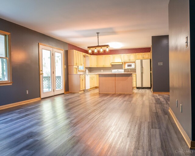 945 Lazenby Rd, Washington Twp, OH 45148 - kitchen featuring white appliances, a kitchen island, wood finished floors, custom exhaust hood, and light brown cabinetry
