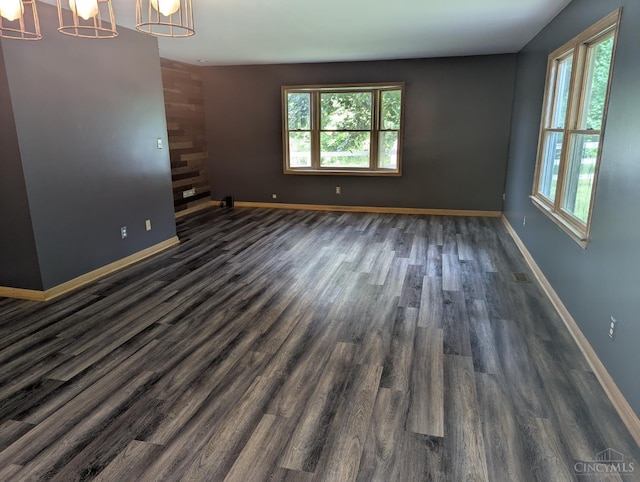 945 Lazenby Rd, Washington Twp, OH 45148 - empty room featuring plenty of natural light and dark wood-style floors